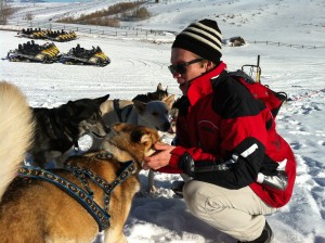 Photo of Dr Mahaney Bonds with Sled Dogs