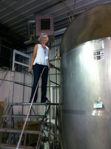 Photo of Veterinary Oncologist Mary Davis Observes Buckwheat Juice Production at Standard Process